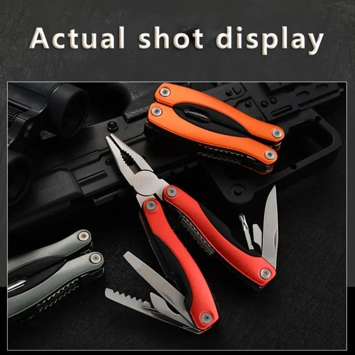 Multitool with orange and red handles on a dark background