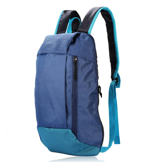 A blue and teal backpack with black padded shoulder straps, shown from a three-quarter angle on a white background.