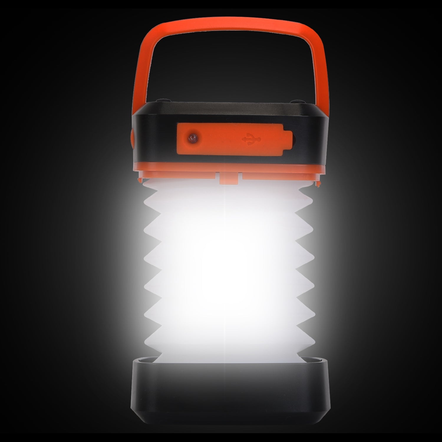 Camping lantern with orange handle and black base on a dark background