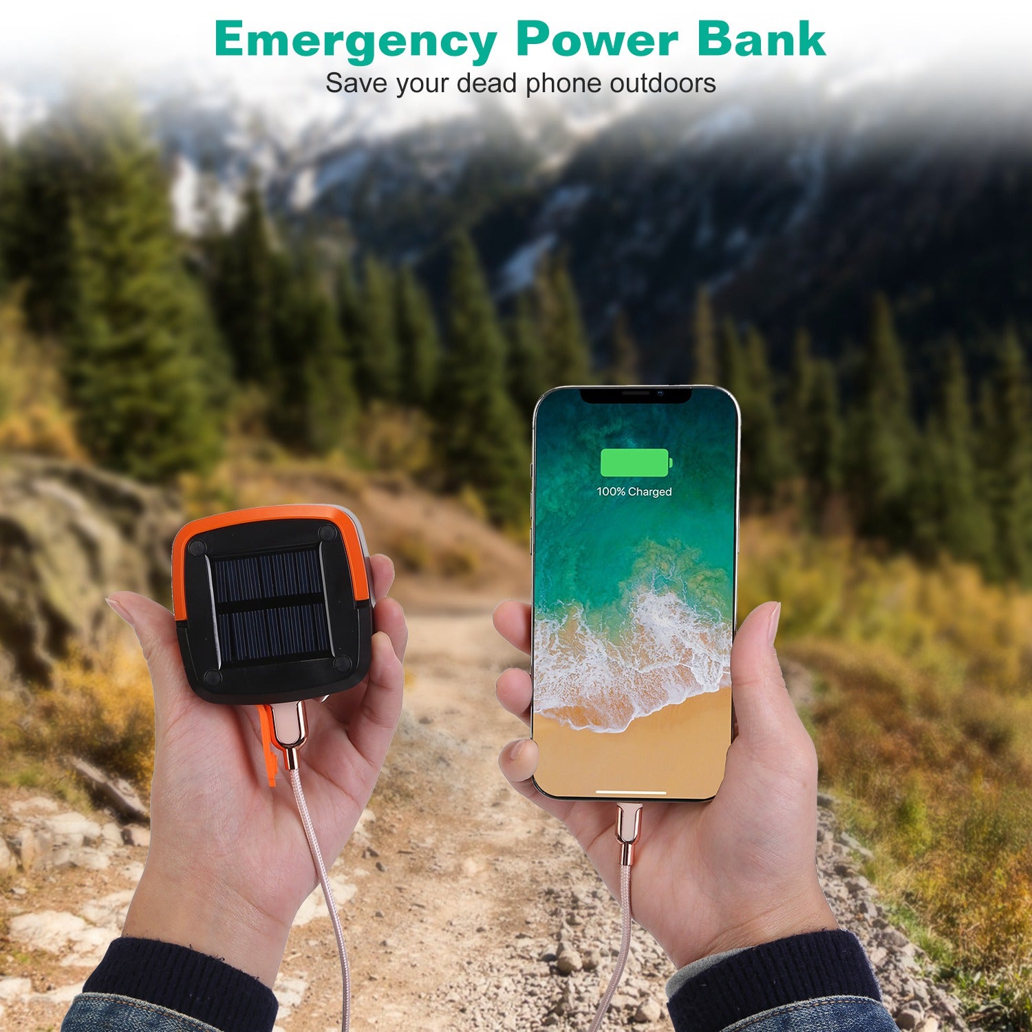 Emergency power bank charging a smartphone outdoors with mountains in the background