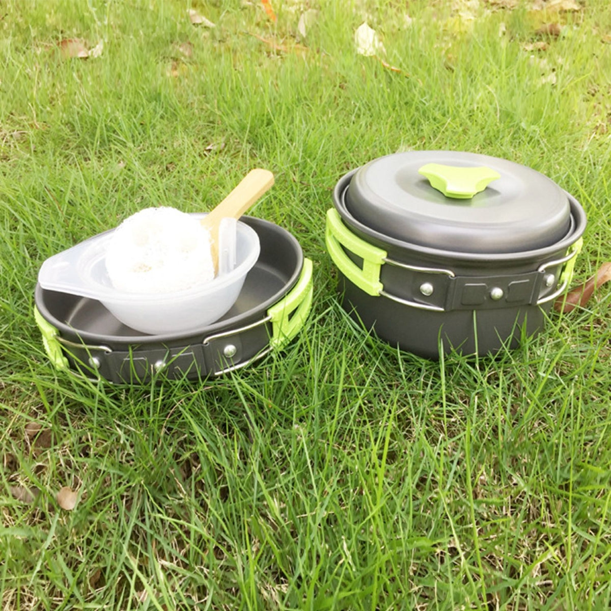 Camping pot held over outdoor grill while cooking food