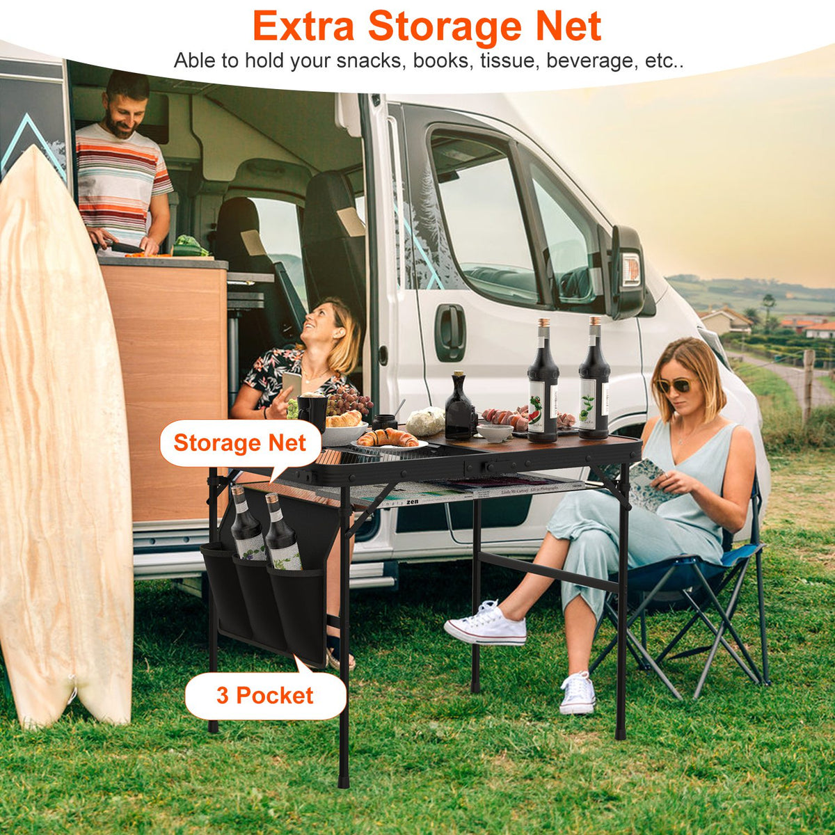 People enjoying a picnic by a van with an extra storage net and table setup.