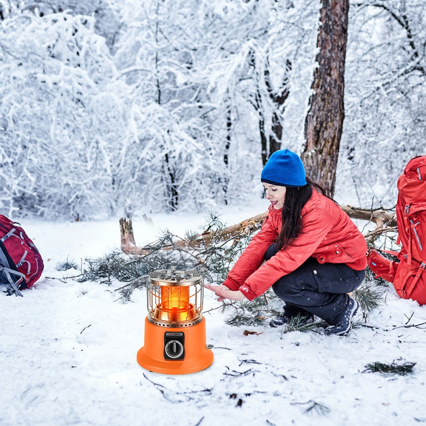 Person using a portable stove in a snowy forest
