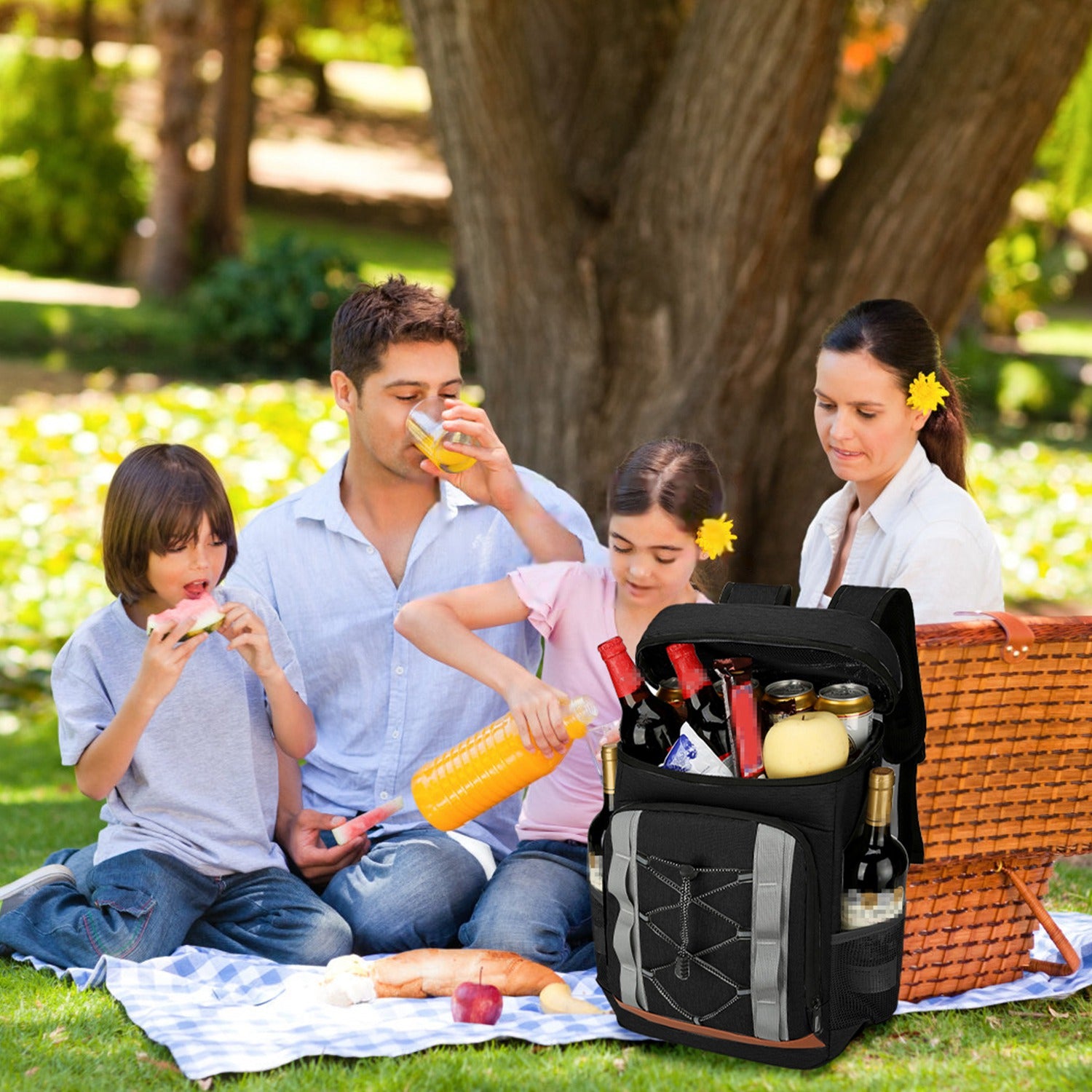 Family having a picnic with a cooler bag in a park