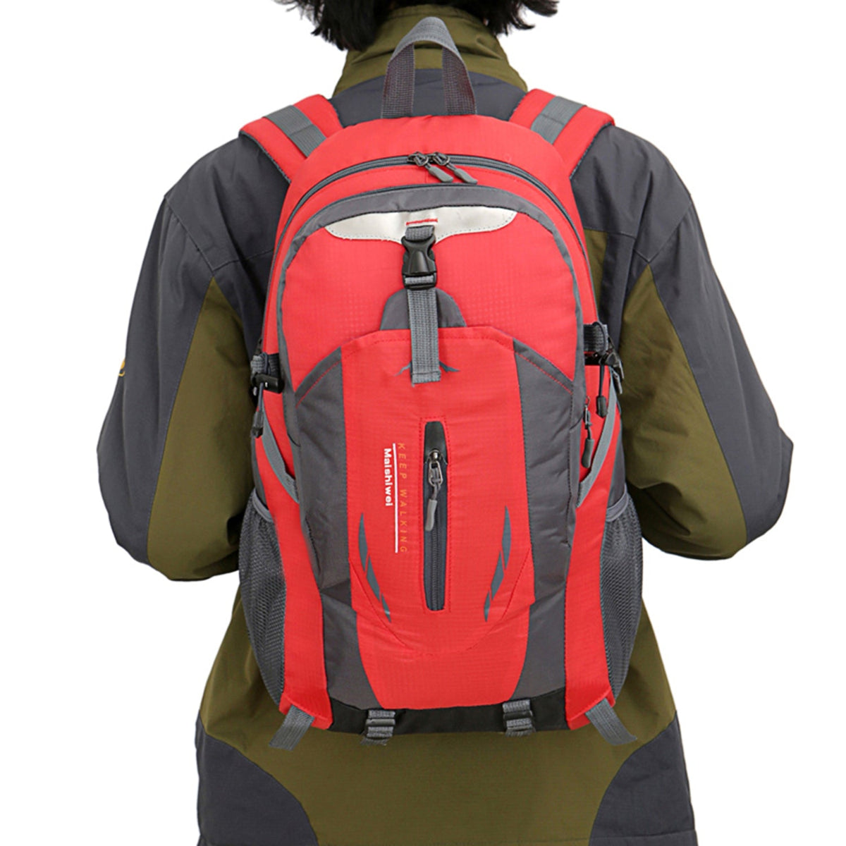 Person wearing a red and gray backpack on a white background