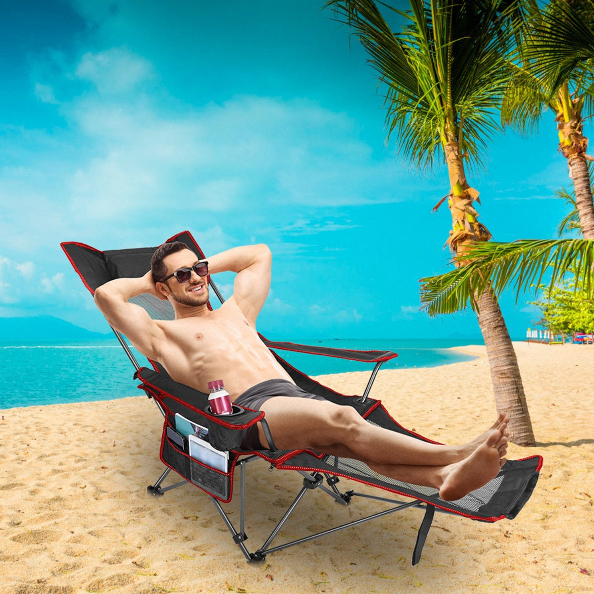 Man relaxing on a beach chair by the ocean with palm trees in the background