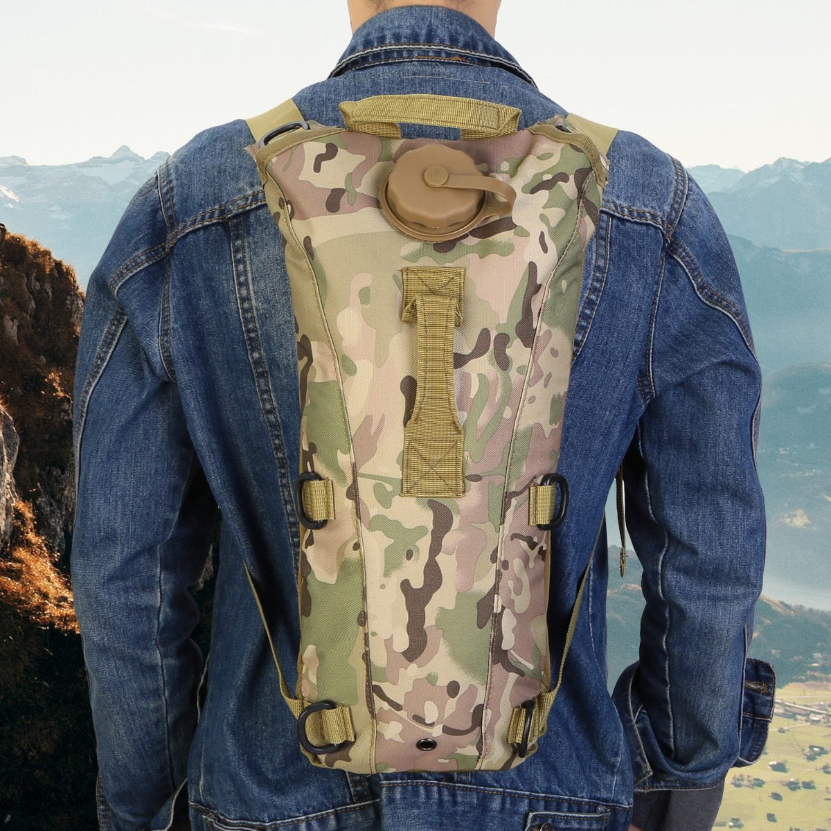 Person wearing a camouflage hydration pack with a scenic background