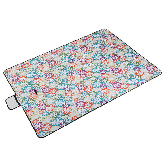 Floral patterned picnic blanket on a white background