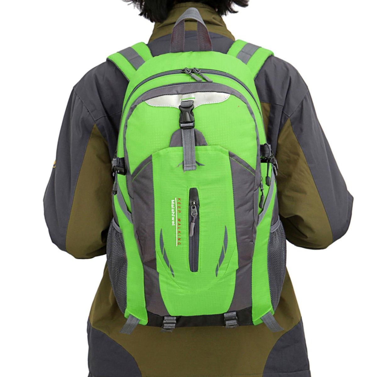 Person wearing a green and gray backpack on a white background