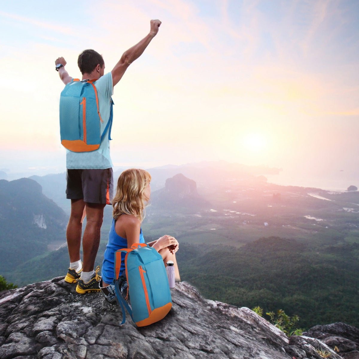 Backpack worn outdoors on a rocky viewpoint with expansive mountain scenery