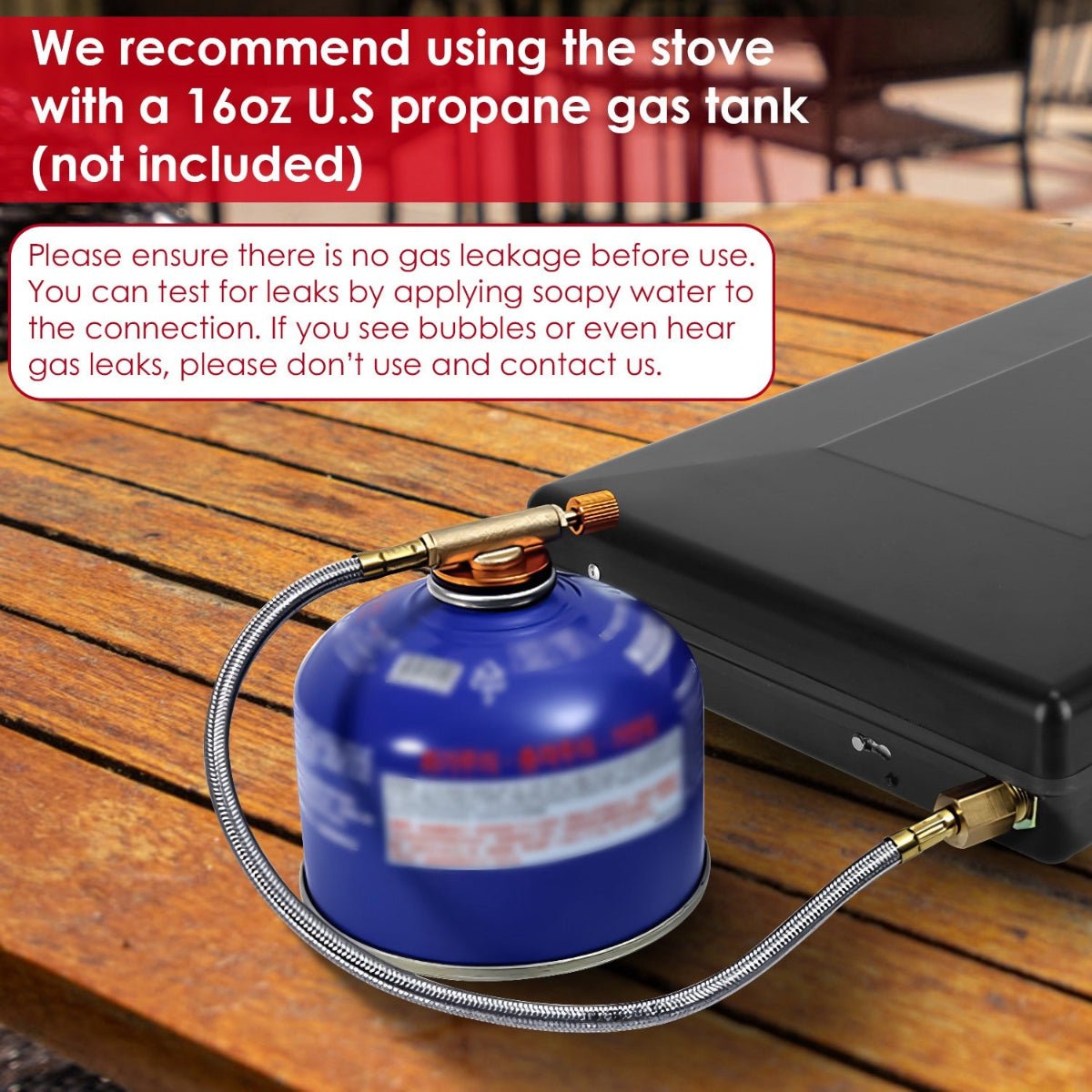 Close-up of removable grate and oil tray inside the open camping stove