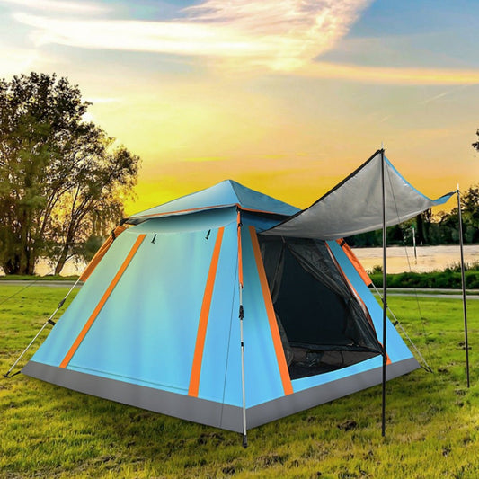 Blue and orange camping tent pitched on grass with extended canopy at sunset