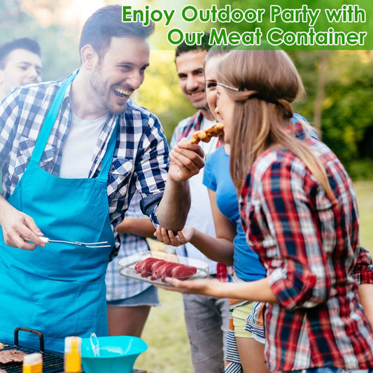 Clear meat storage container holding raw meat on an outdoor picnic table