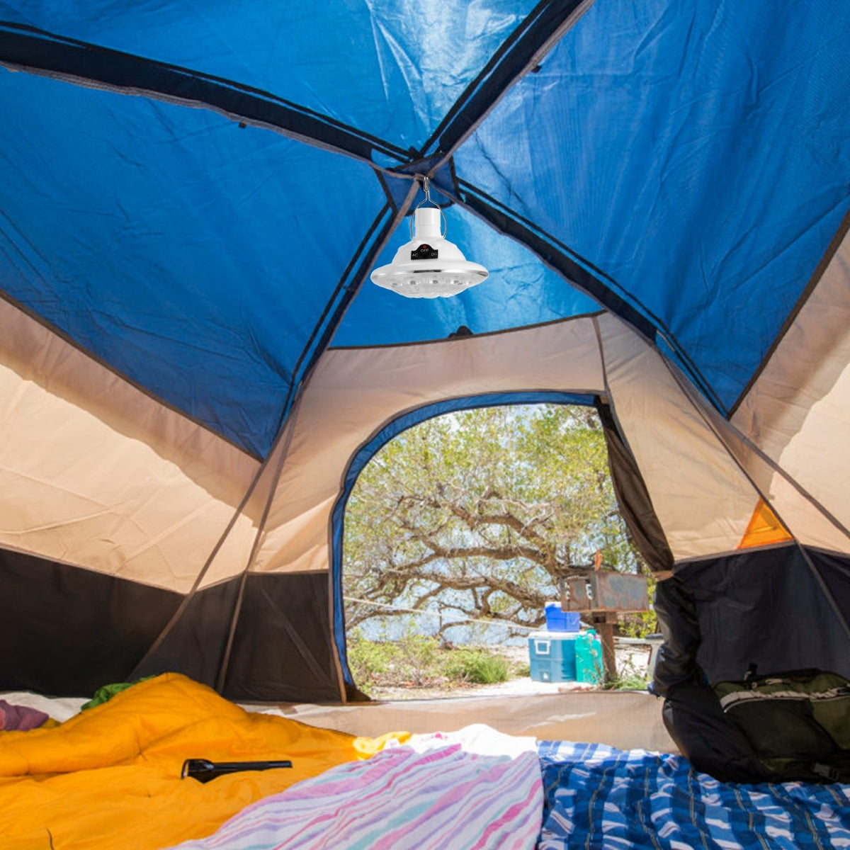 Solar hanging light installed inside blue camping tent